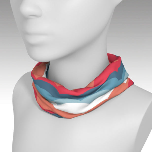 Headband used as a scarf with fun One Plane Jane cloud design.  Coral, orange, blue, white. Perfect for travel, flying, pre-flight or dress up a t-shirt