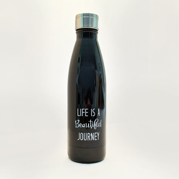 Black waterbottle with lid. Words "Life is a Beautiful Journey" printed in white on front.